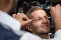 Closeup of process of threading procedure in barber shop Royalty Free Stock Photo