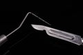 Closeup of professional dental tools. Periodontal probe and scalpel