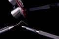 Closeup of professional dental tools. Periodontal probe, scalpel and magnifying glasses