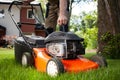 Professional gardener turning on the lawn mower