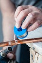 Closeup professional master plumber holding flux paste for soldering and brazing seams of copper pipe gas burner. Concept Royalty Free Stock Photo