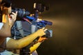 Closeup of professional television camera in event at night. Royalty Free Stock Photo