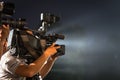 Closeup of professional television camera in event at night. Royalty Free Stock Photo