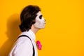 Closeup profile photo of creepy zombie dreamy guy empty space send air kiss bride corpse wear white shirt rose sugar Royalty Free Stock Photo