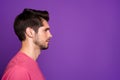 Closeup profile photo of macho guy serious perfect appearance neat hairdo bristle not smiling look side empty space wear Royalty Free Stock Photo