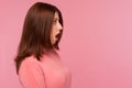 Closeup profile portrait brunette woman standing with big eyes and widely open mouth, surprised excited, cant believe in that