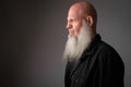 Closeup profile view of mature bald man with long beard Royalty Free Stock Photo