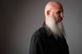 Closeup profile view of mature bald man with long beard Royalty Free Stock Photo