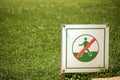 Sign of Not Walk on the Grass with Green Lawn on Background Royalty Free Stock Photo