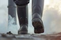 closeup of protective boots walking near smoking smokestack Royalty Free Stock Photo