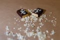 Closeup protein bar in the cut sprinkled with rice flakes on the baking paper, Teflon paper, Diet snacks, sports nutrition. Whey p Royalty Free Stock Photo