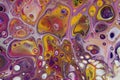 Closeup on a psychedelic abstract acrylic pour painting done in four colors. Royalty Free Stock Photo