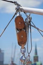 Closeup, pulley and hook with rope on ship, dock or harbor with transport and navigation for sailing. Yacht, cruise with