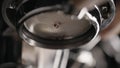 closeup pulling espresso with bottomless portafilter