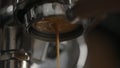 closeup pulling espresso with bottomless portafilter