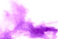 Closeup of purple dust particles splash on background.Purple color powder explosion cloud  on white background Royalty Free Stock Photo