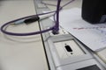 Closeup of a purple ethernet cable plugged into a socket Royalty Free Stock Photo