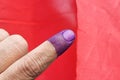 Closeup of purple indelible ink on index finger. Used in election in Malaysia to prevent fraud. Royalty Free Stock Photo