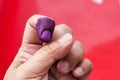 Closeup of purple indelible ink on index finger. Used in election in Malaysia to prevent fraud. Royalty Free Stock Photo