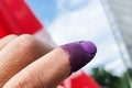 Closeup of purple indelible ink on index finger. Used in election in Malaysia to prevent fraud. Royalty Free Stock Photo