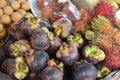 Closeup of purple mangosteen and red rambutan on a local market in Thailand, Asia