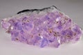 Closeup of purple quartz amethyst isolated in gray background Royalty Free Stock Photo