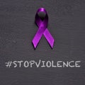 Purple ribbon and text stop violence