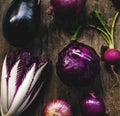 Closeup of purple vegetable group collection on wooden table