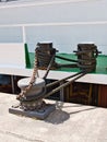 Closeup of pylons where a ship is moored with ropes and a chain Royalty Free Stock Photo