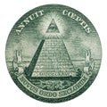 Close up of the pyramid symbol and Annuit coeptis motto and the Eye of Providence on the one dollar.