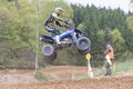 Closeup of quad rider in high jumping