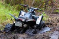 Closeup of a quad stuck in mud