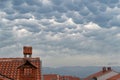 Closeup of a quaint town under the Mammatus clouds