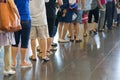 Closeup Queue of Asian people waiting at boarding gate at airport