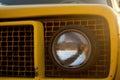 A closeup of a race cars front bumper and grille the details of the metal and paint are clearly visible. Speed drive Royalty Free Stock Photo