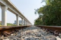 Closeup of railway track, a shallow depth of field focusing on the railroad ties and rocks on the track. Metal rails are fastened Royalty Free Stock Photo