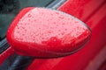 rain drops on red car mirror Royalty Free Stock Photo