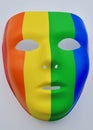 A closeup of a rainbow mask against a white background Royalty Free Stock Photo