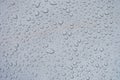 Closeup of raindrops on gray window glass texture background Royalty Free Stock Photo