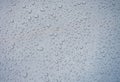 Closeup of raindrops on gray window glass texture background Royalty Free Stock Photo