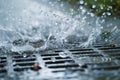 closeup of raindrops splashing near a storm drain