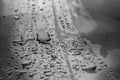 Closeup of raindrops and spray of rain on a metal table Royalty Free Stock Photo