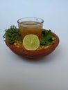 Ram Navami Hindu Festival Food Musk Melon Cool drink, Hesaru Bele with Lemon in a Sand Bowl on White Background