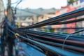 Closeup randomly hanging wires on electric poles Royalty Free Stock Photo