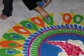 Closeup of rangoli making on the ground for diwali, pooja, traditional, cultural