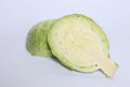 Closeup of a raw cabbage cut in half isolated on a white background Royalty Free Stock Photo