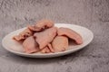 raw chicken wings on gray cement background