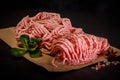 closeup raw forcemeat on craft paper with spices and basil Royalty Free Stock Photo