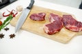 Sirloin beef steak with knife on chopping board