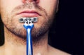 Closeup of a razor on his chin stubbly. Royalty Free Stock Photo